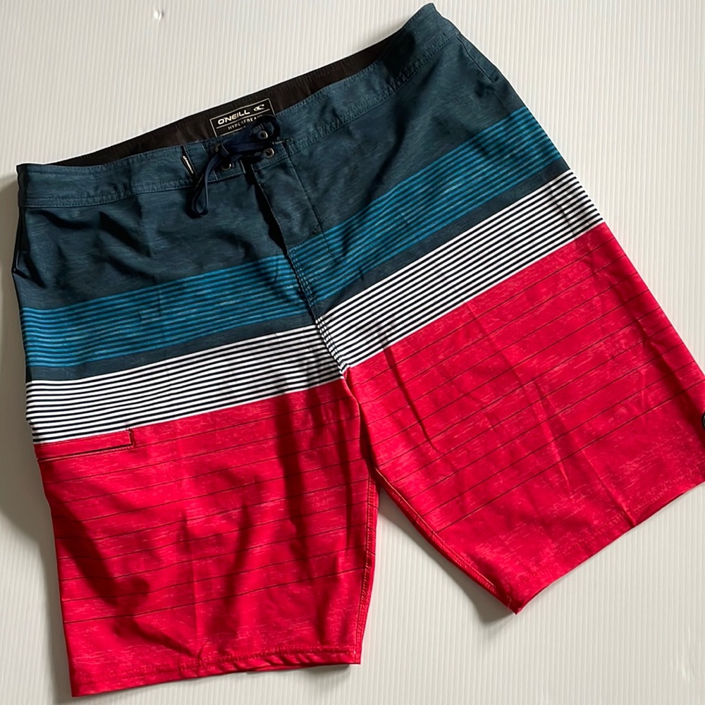 O’NEILL Hyperfreak red, white and blue striped board short.  Men’s size 36